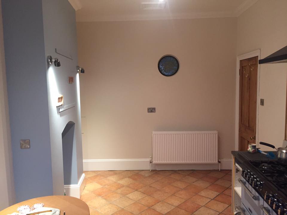 Kitchen painted in light blue and off-white