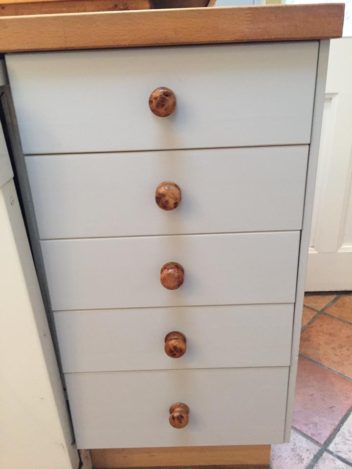 Hand-sprayed grey kitchen units with a smooth, factory-style finish